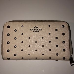 Coach studded accordion zip wallet